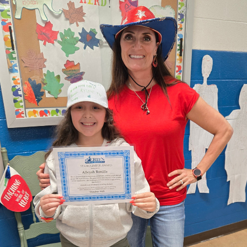 Alleyah Bonilla, Pfeiffer-Burliegh's Stairclimber for November, poses with his award plaque.